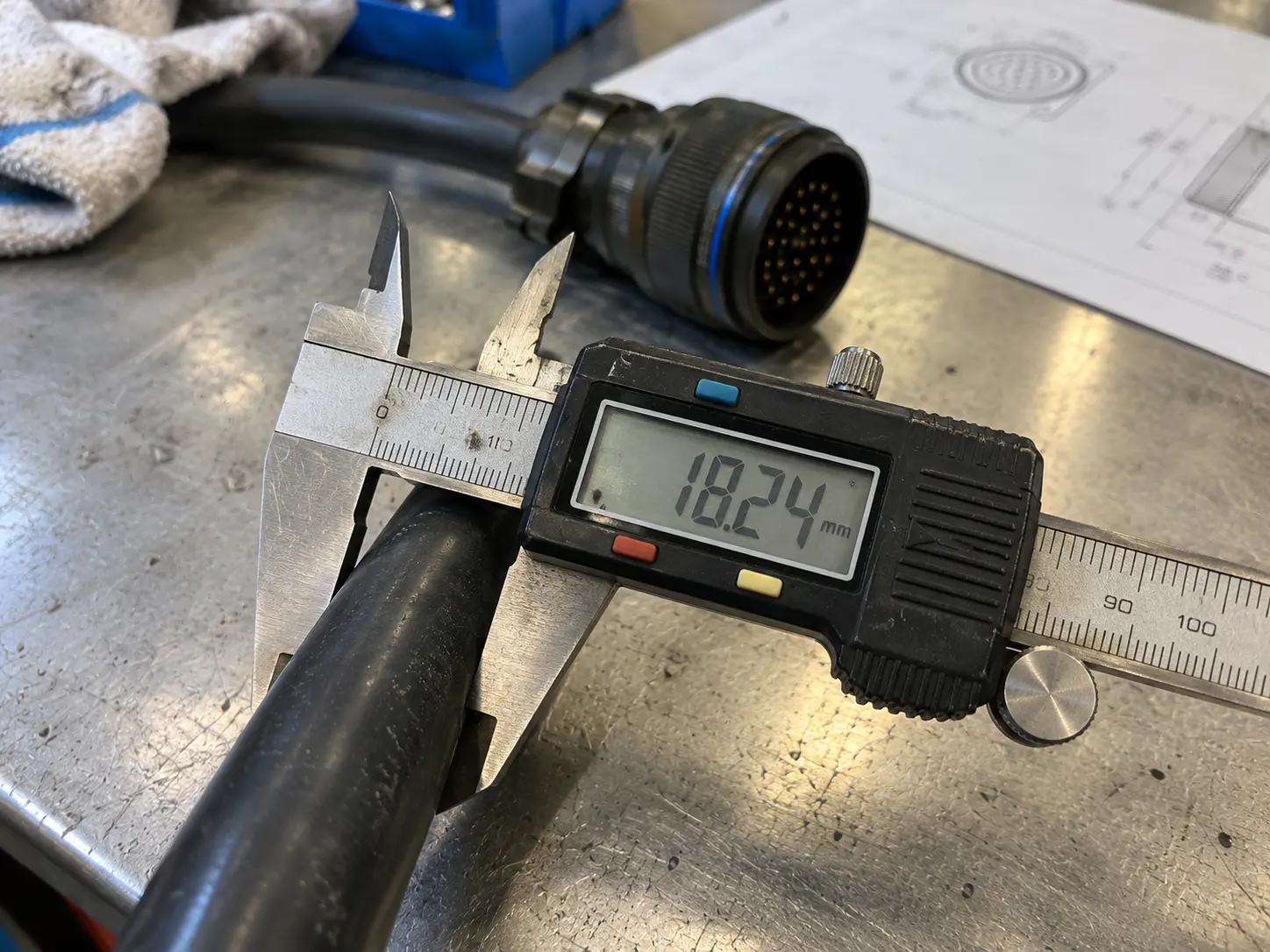 Measuring cable outer diameter on the round jacket section with a caliper